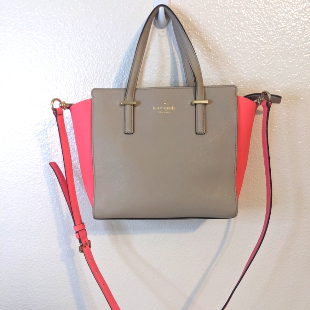 Kate Spade gray and neon pink satchel bag with crossbody strap.